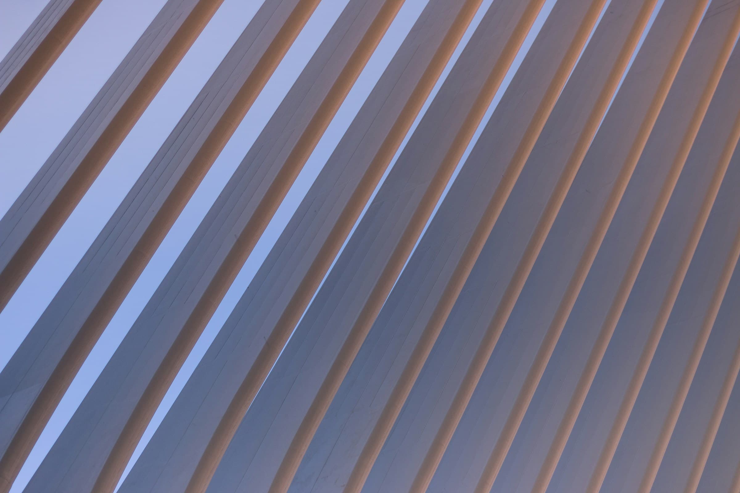 Abstract diagonal lines against a blue sky